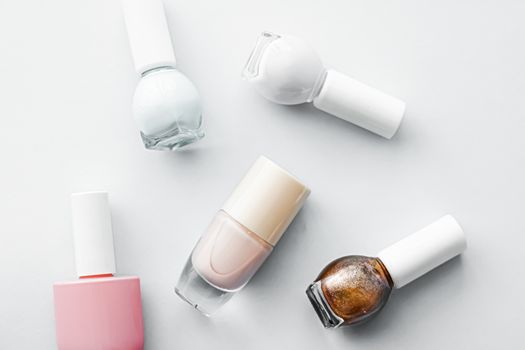 Nail polish bottles on white background, beauty branding