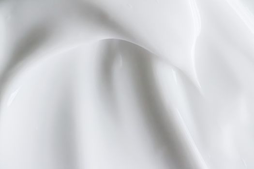 Pure white cream texture as abstract background, food substance or organic cosmetics