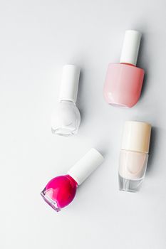 Nail polish bottles on white background, beauty branding