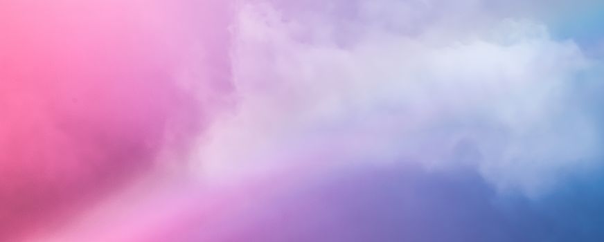 Rainbow in fantasy pink and blue sky, spiritual and nature backgrounds