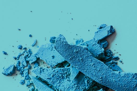 Blue eye shadow powder as makeup palette closeup, crushed cosmetics and beauty textures