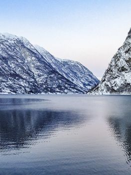 Winter landscape at the frozen fjord lake river in Framfjorden, Vestland, Vik, Norway.