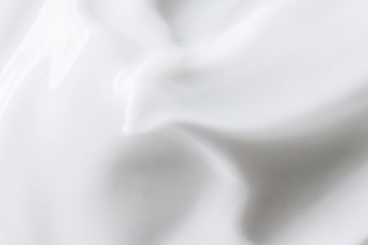 Pure white cream texture as abstract background, food substance or organic cosmetics