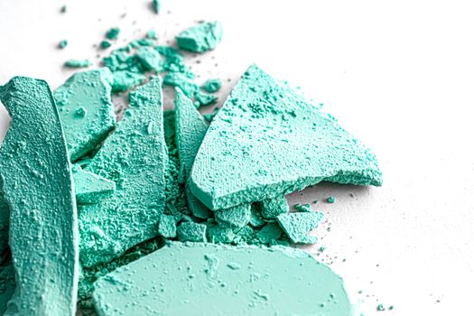 Mint eye shadow powder as makeup palette closeup isolated on white background, crushed cosmetics and beauty textures