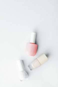 Nail polish bottles on white background, beauty branding