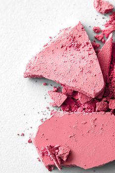 Red eye shadow powder as makeup palette closeup isolated on white background, crushed cosmetics and beauty textures