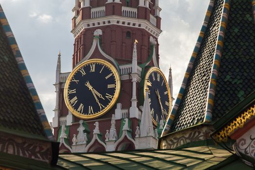 Kremlin Clock on the Spasskaya Tower of Kremlin palace against cloudy sky in Moscow,Russia