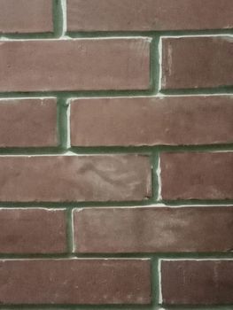 red colored bricks wall closeup in house