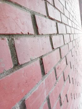 red colored bricks wall closeup in house