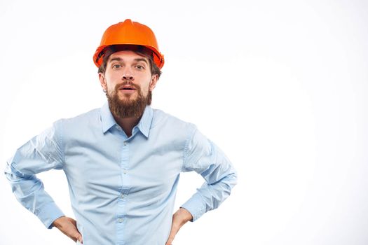 Man in working uniform orange hard hat lifestyle official. High quality photo