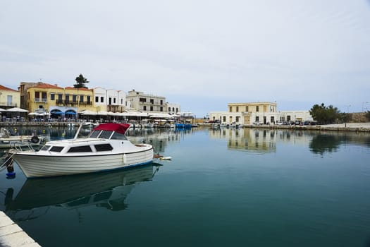 RETHYMNO , GREECE - MAY 30, 2019: View at sea port of Rethymno, the Crete island, Greece. The town is famous for its venetian architecture and beautiful views.