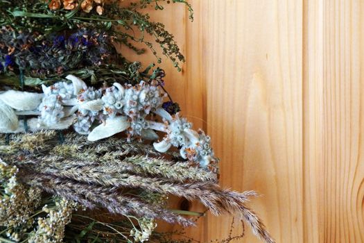 dry medicinal herbs on a wooden background, copy space.