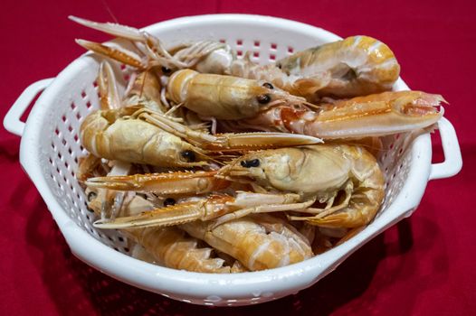 Prawns to drain ready for fresh fish soup with seafood