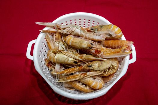 Prawns to drain ready for fresh fish soup with seafood