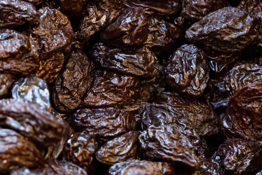 Organic, healthy prunes, dried plums, on display for sale on a market stall