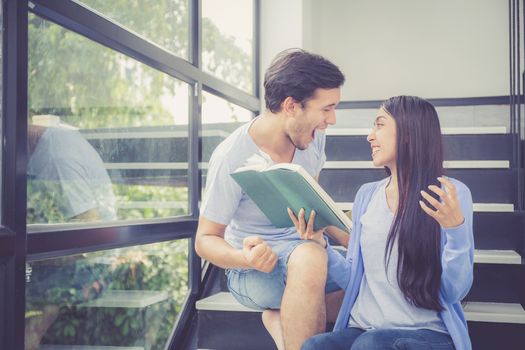 Couple asian handsome man and beautiful woman reading book and glad at home, boyfriend and girlfriend with activities together for leisure, education success concept.
