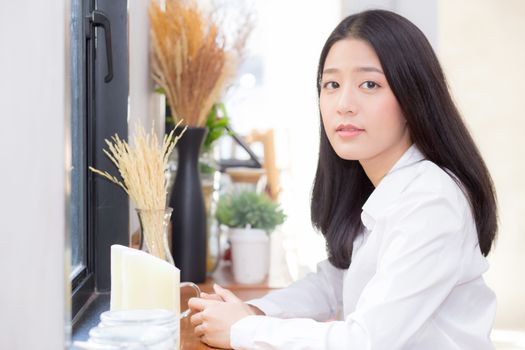 Beautiful of portrait asian young woman working online sitting at coffee shop, professional female freelancer relax and leisure, business concept.