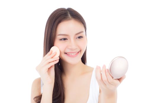 Portrait of beautiful asian woman applying powder puff at cheek makeup of cosmetic, beauty of girl with face smile isolated on white background, wellness and healthcare concept.