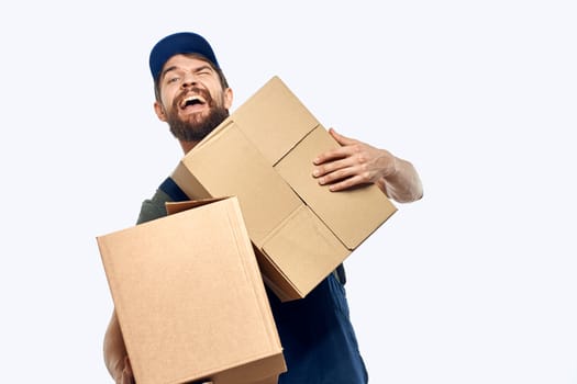 Working man with boxes in hands delivery service work lifestyle. High quality photo