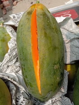 tasty and healthy colorful papaya close- up on shop