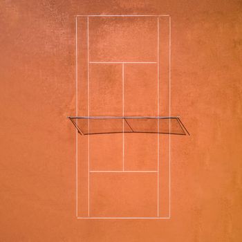 Aerial view of a single red clay tennis court without players.