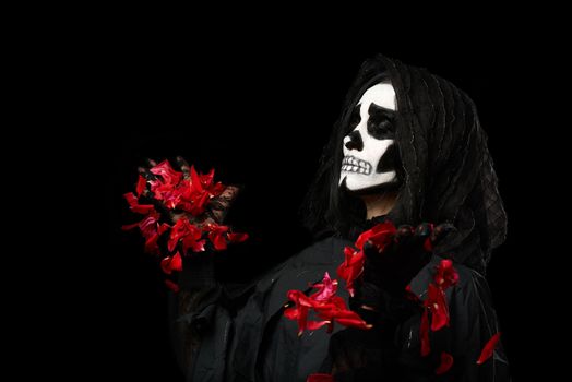 woman in black clothes and skull makeup, black background, carnival Halloween image