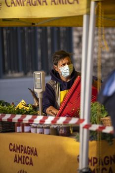 terni,italy october 23 2020:walking woman at market with medical mask