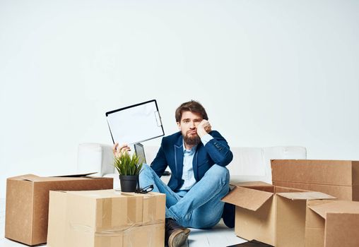 Business man boxes with things documents unpacking lifestyle official. High quality photo