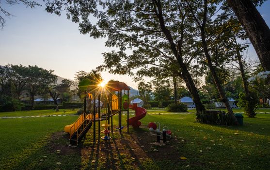 Colorful playground and sunrise  on yard in the park