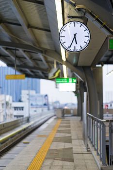 White clock on train station, starting a new day