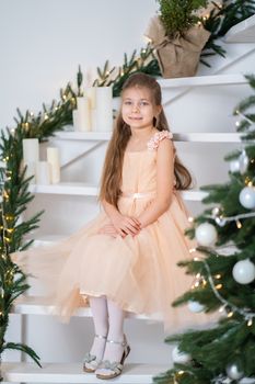 Little girl in princess dress celebrates christmas. Christmas magic fairy tale. Happy childhood.