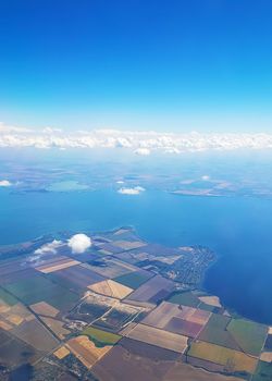 The view from the airplane window to the ground. Landscape view from the sky.