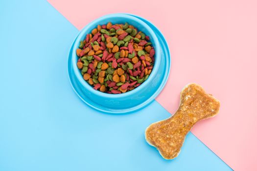 Pet food and snack with copy space on color background