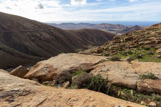 Panoramic view at landscape between Betancuria and Pajara  on Fuerteventura, Spain with multi colored volcanic hills and mountains