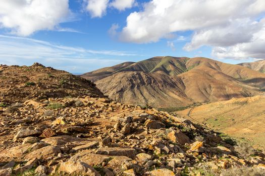 Panoramic view at landscape between Betancuria and Pajara  on Fuerteventura, Spain with multi colored volcanic hills and mountains