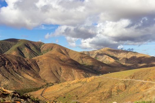 Panoramic view at landscape between Betancuria and Pajara  on Fuerteventura, Spain with multi colored volcanic hills and mountains