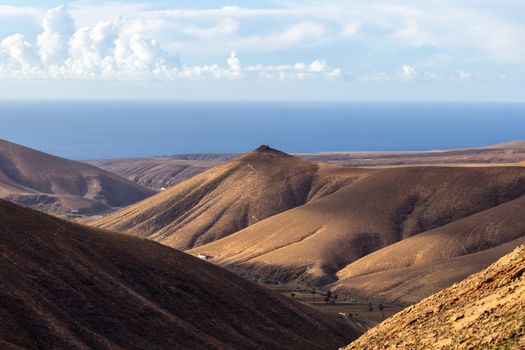 Panoramic view at landscape between Betancuria and Pajara  on Fuerteventura, Spain with multi colored volcanic hills and mountains