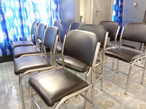 Black colored chair stock in hall room