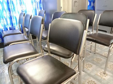 Black colored chair stock in hall room