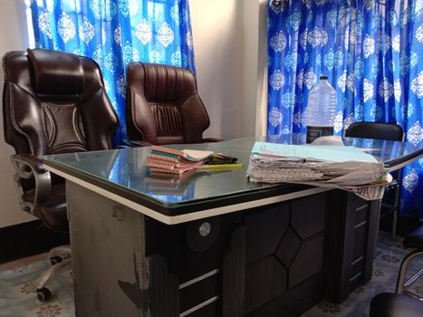 chocolate colored chair stock and wooden table in hall room