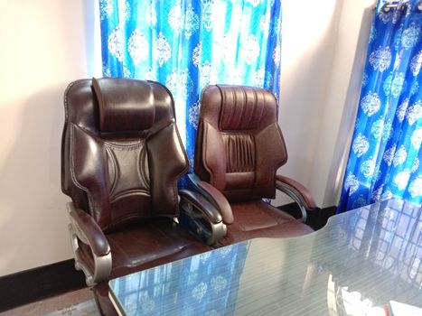 chocolate colored chair stock and wooden table in hall room