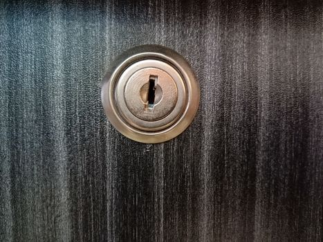 lock and key closeup on wooden board for sell