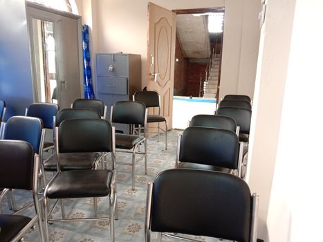 Black colored chair stock in hall room