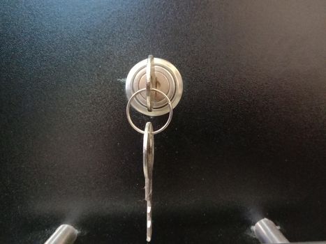 lock and key closeup on wooden board for sell
