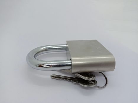 lock and key closeup on gray background