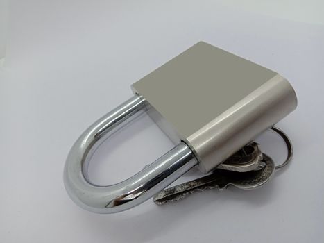 lock and key closeup on gray background