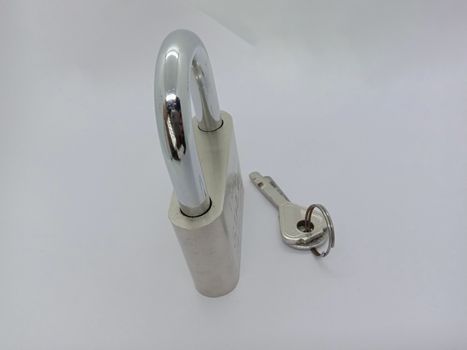 lock and key closeup on gray background