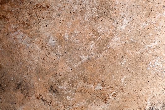 Concrete beige brown black background with scuffs and splashes. Textured wall texture in the grunge style with soft focus. Space for text