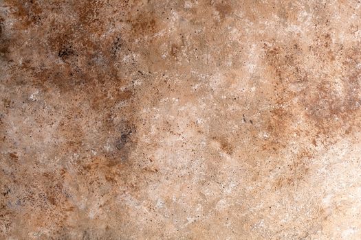 Concrete beige brown black background with scuffs and splashes. Textured wall texture in the grunge style with soft focus. Space for text