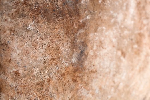 Concrete beige brown black background with scuffs and splashes. Textured wall texture in the grunge style with soft focus. Space for text